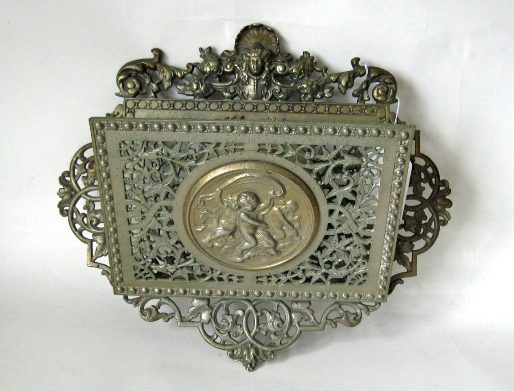 Victorian metal wall mounted magazine rack, 14 by 16.5: Victorian metal wall mounted magazine rack, 14 by 16.5 inches, framed. Condition: good.