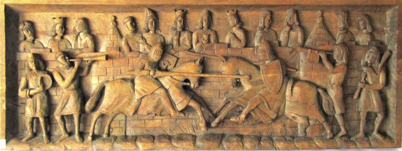 Medieval style carved wooden panel of jousting knights, (1 of 2)