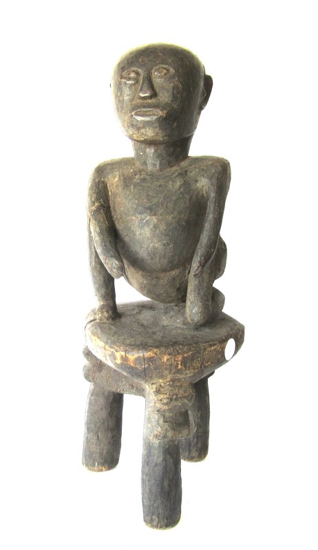 African Tanzania carved wooden figure on stool., (1 of 2)