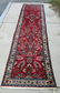 Persian Oriental runner, 132 by 29 inches. Condition: