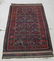 Old Baluch Oriental rug, 65 by 38 inches. Condition: