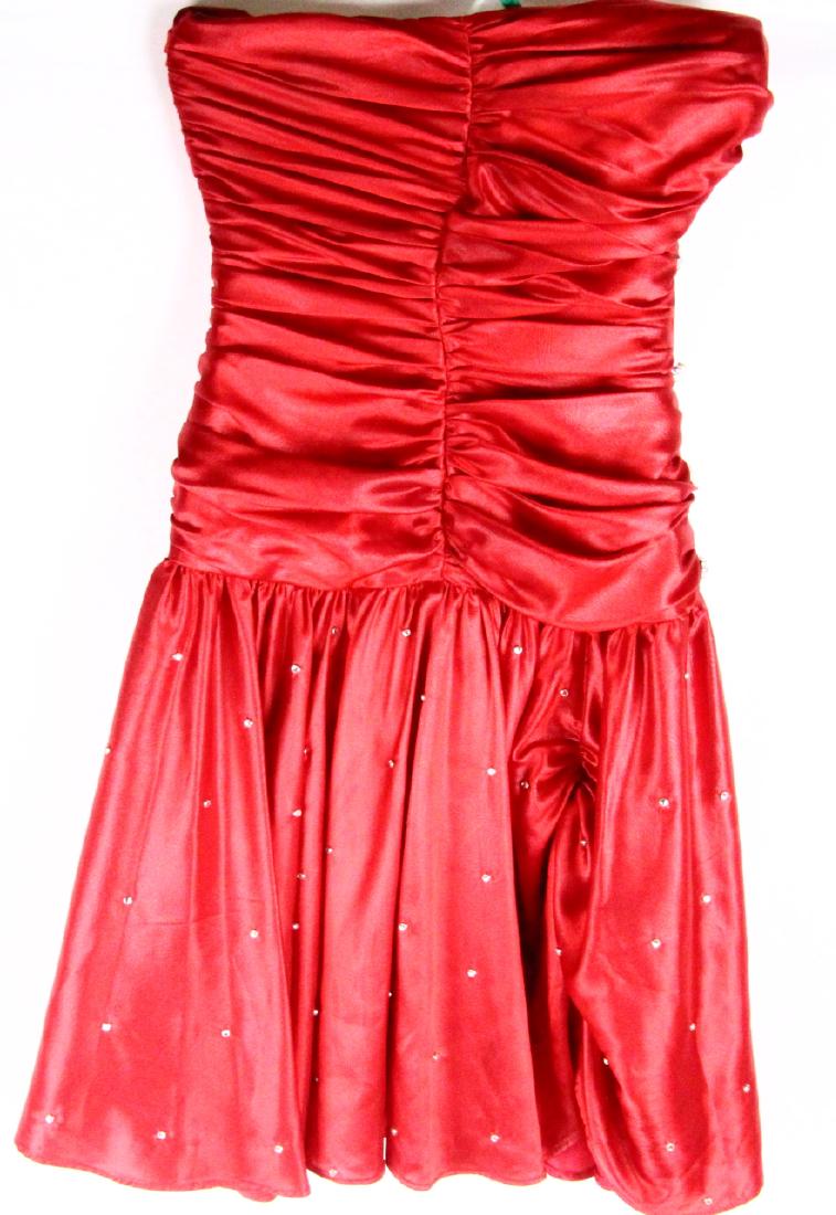 Stella Parton Personally Worn Satin Dress W/COA: Stella Parton Personally Owned and Worn Red Satin Strapless Cocktail Dress Embellished With Rhinestones W/COA - This beautiful dress is a bright red, satin dress made for Stella Parton. The dress has