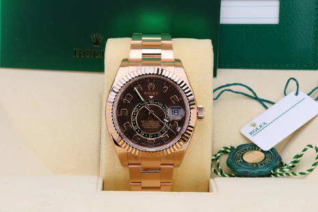 Rolex Sky-Dweller 42mm 18K Watch in Original Box: Rolex Oyster Perpetual Sky-Dweller 42mm Solid 18K Everose Gold Watch W/Chocolate Dial in Mint Condition in Original Box W/Papers - This magnificent timepiece was crafted by the artisans at the world r