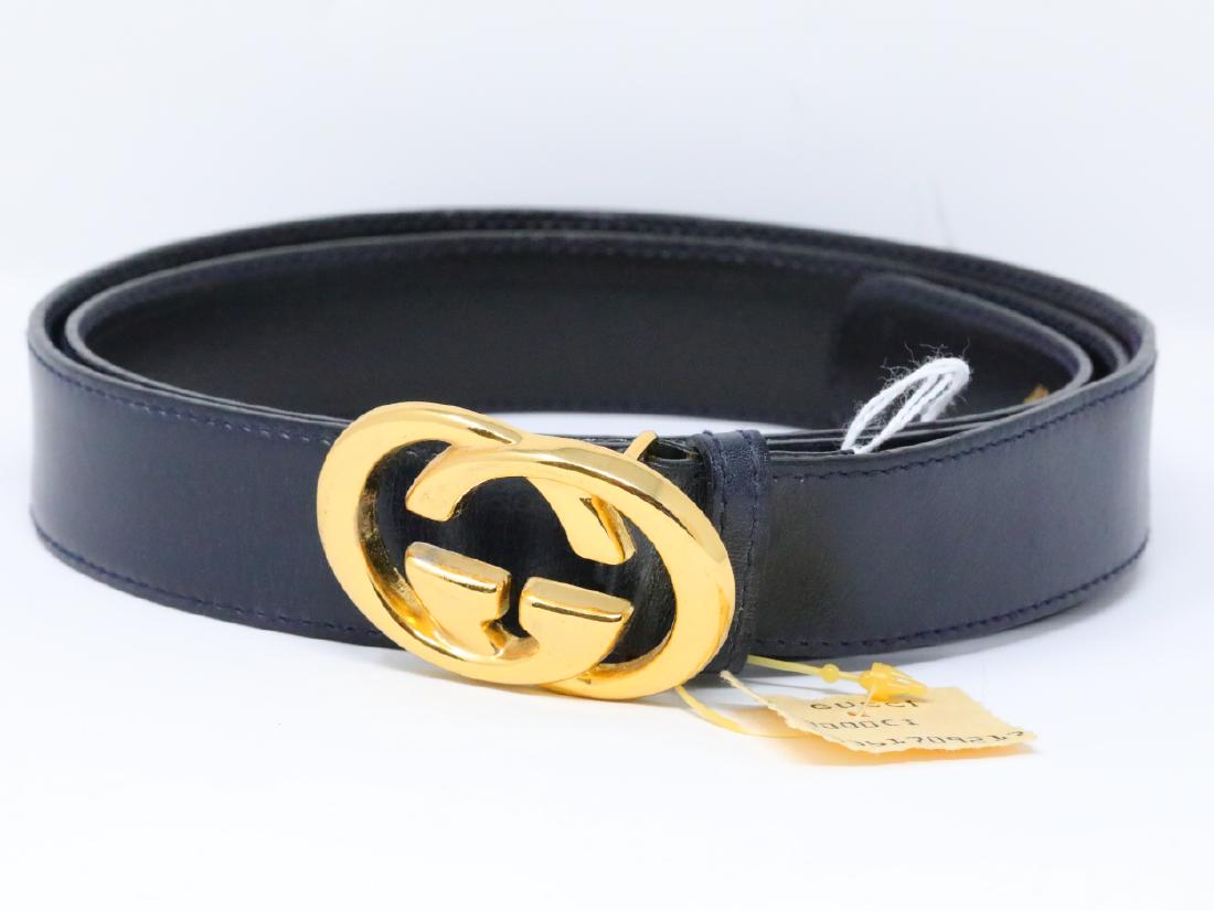 Gucci 1980s GG Logo Navy Leather Belt New W/Tag: Gucci Vintage 1980s GG Logo Navy Leather Belt New W/Tag - This vintage belt by Gucci is an icon of 1980s design. The belt is an ultra soft navy leather and is finished with a 2.25" x 1.5" gold tone 'G