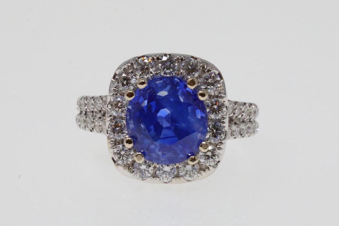 6.09ct Kashmir Sapphire, 1ctw Diamond & 18K Ring: 6.09ct Kashmir No Heat Sapphire W/SSEF & Gubelin Certification in 1.00ctw VS1-VS2/F-G Diamond & Solid 18K White Gold Halo Setting (Comes W/$365,000 Appraisal) - This magnificent ring boasts a stunning