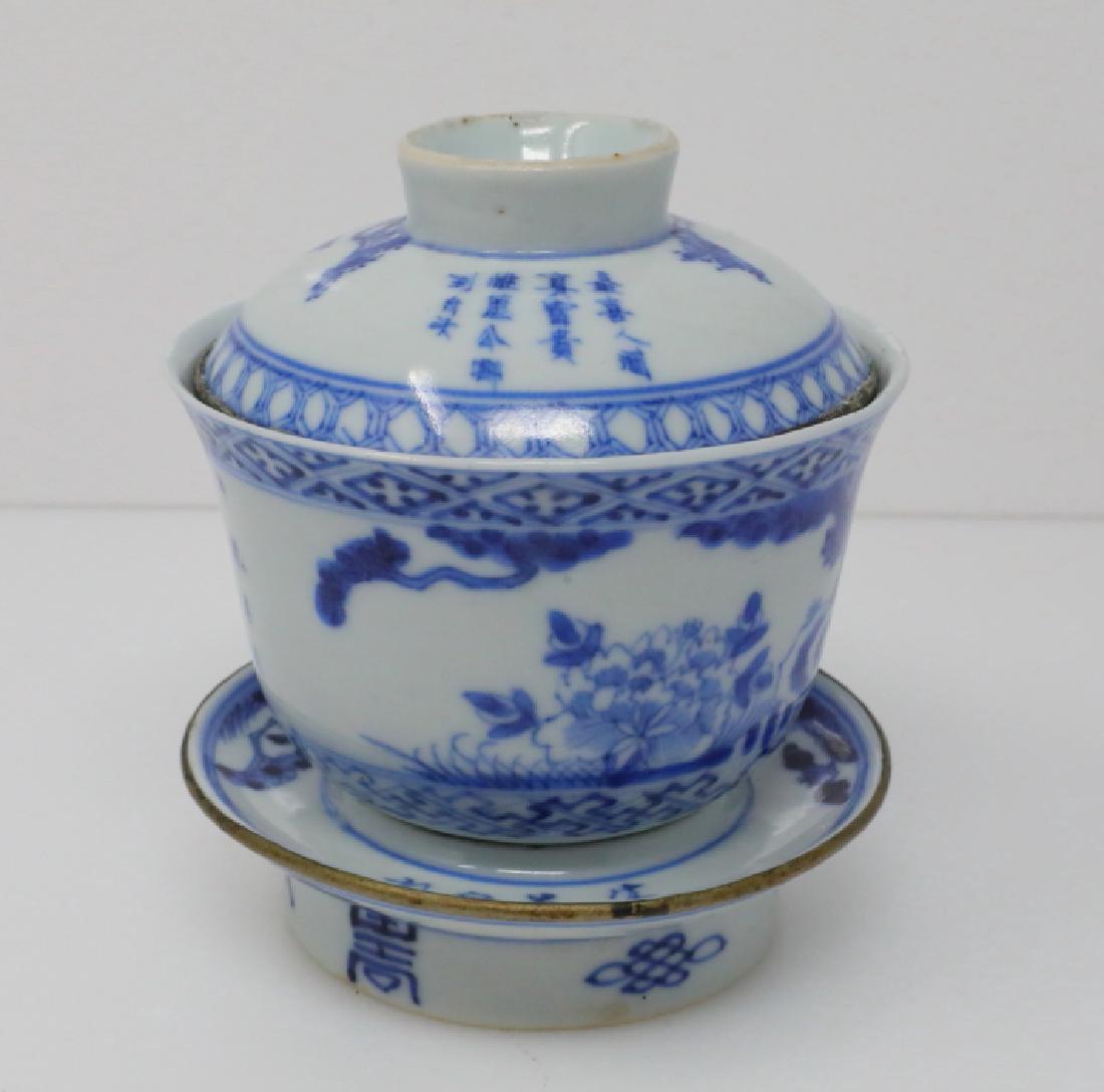 Vietnamese Bleu de Hue Porcelain Teacup & Stand: Vietnamese Bleu de Hue Porcelain Lidded Teacup & Stand W/Metal Rims, Longevity Character, Buddhist Wan & Four Character Marking - This porcelain lidded teacup is elaborately decorated in a vivid blue 