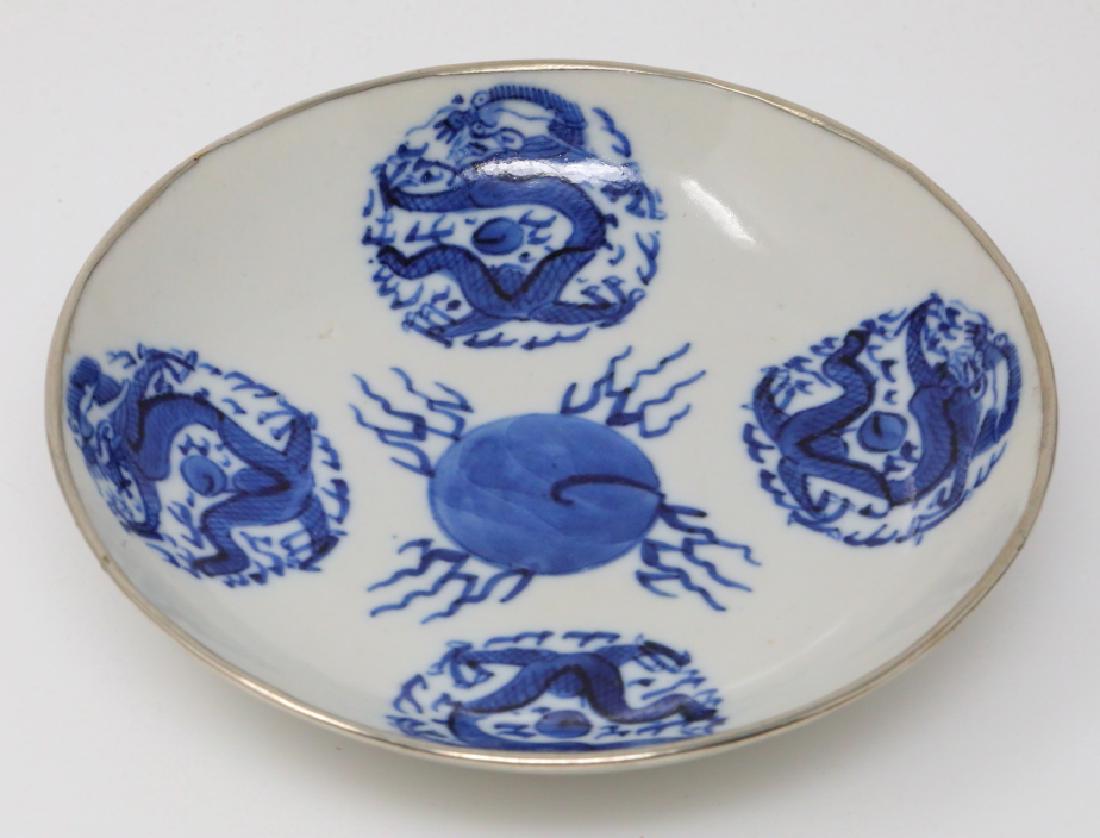 Vietnamese Bleu de Hue Rolling Dragon Dish: Vietnamese Bleu de Hue Porcelain Rolling Dragon Dish W/Metal Rim Marked "Jade Trinket" (From a Vietnamese Royal Family) - This porcelain dish is elaborately decorated in vivid underglazed blue with a 