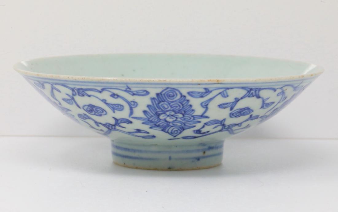 Vietnamese Bleu de Hue Porcelain Conical Bowl: Vietnamese Bleu de Hue Porcelain Conical Bowl W/Archaic Seal Marking (From a Vietnamese Royal Family) - This porcelain bowl is decorated in a vivid blue underglaze with a dense foliate motif. The inte