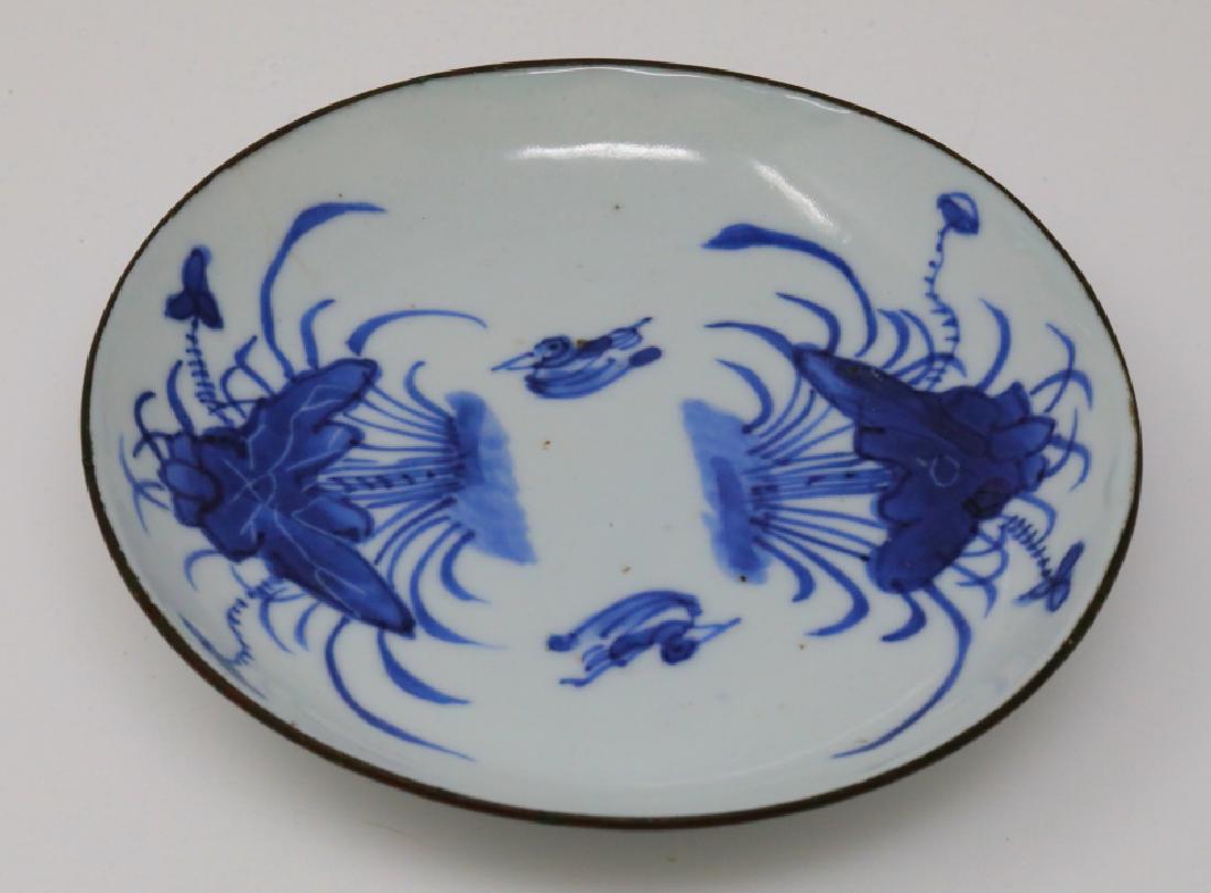 Vietnamese Bleu de Hue Blooming Lotus Dish: Vietnamese Bleu de Hue Porcelain Blooming Lotus Dish W/Metal Rim Marked "Jade Trinket" (From a Vietnamese Royal Family) - This porcelain dish is elaborately decorated in vivid underglazed blue with tw