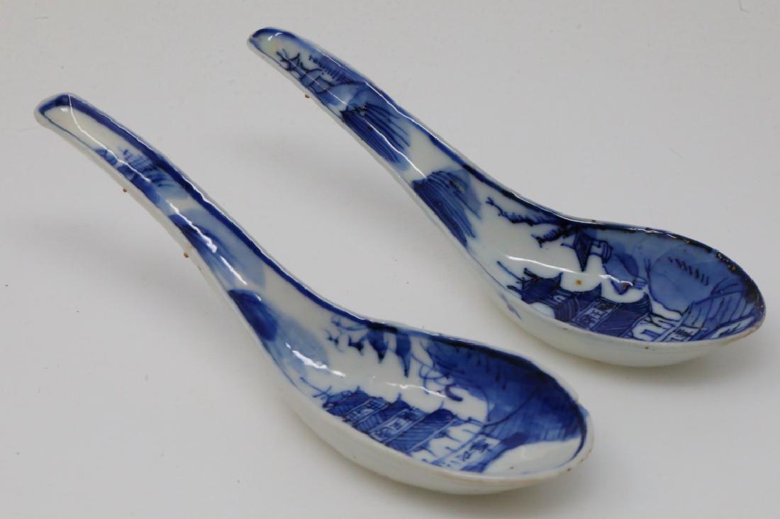 Vietnamese Pair of Bleu de Hue Soup/Rice Spoons: Vietnamese Pair of Bleu de Hue Porcelain Soup/Rice Spoons (From a Vietnamese Royal Family) - This pair of porcelain soup spoons are elaborately decorated in vivid underglazed blue with an ornate lands