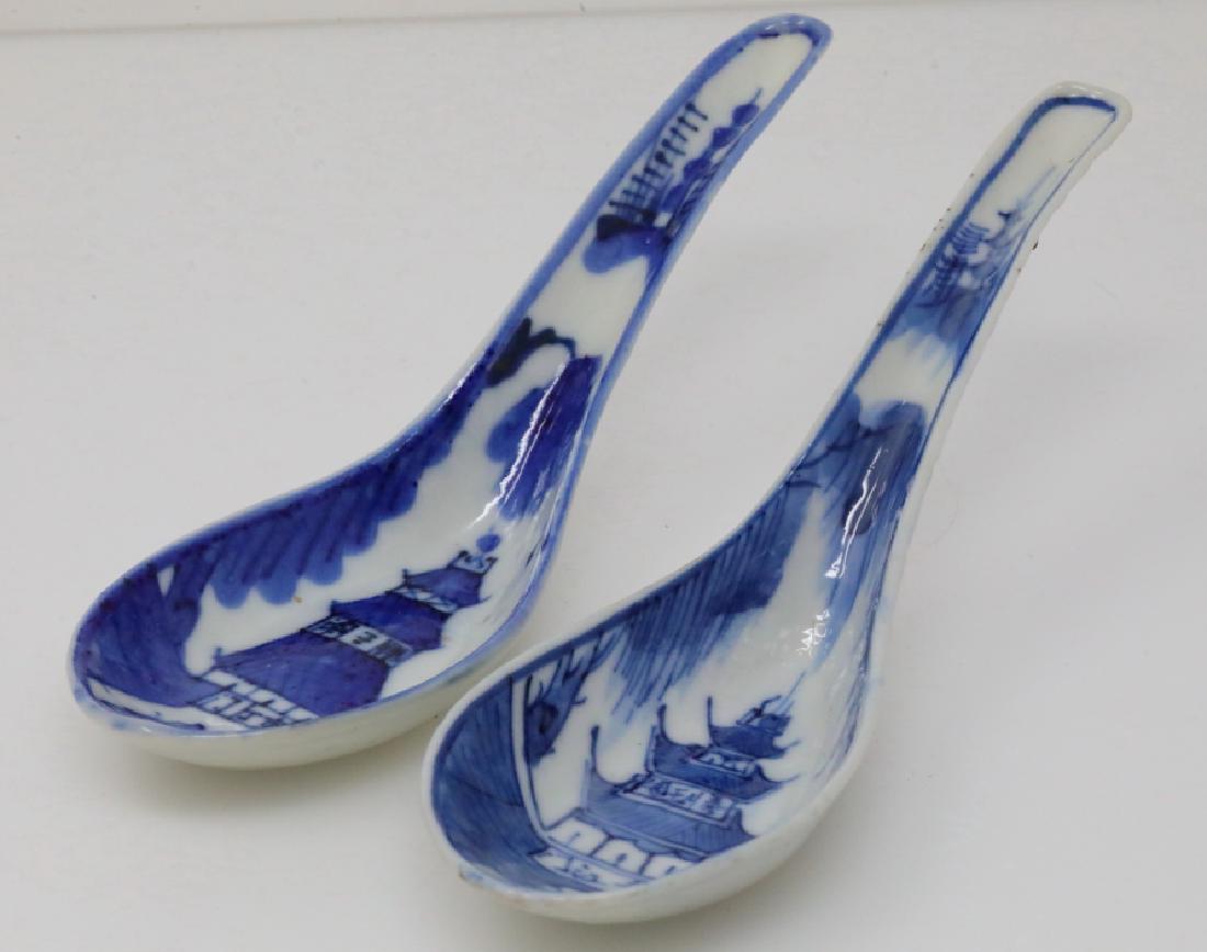 Vietnamese Pair of Bleu de Hue Soup/Rice Spoons: Vietnamese Pair of Bleu de Hue Porcelain Soup/Rice Spoons (From a Vietnamese Royal Family) - This pair of porcelain soup spoons are elaborately decorated in vivid underglazed blue with an ornate lands