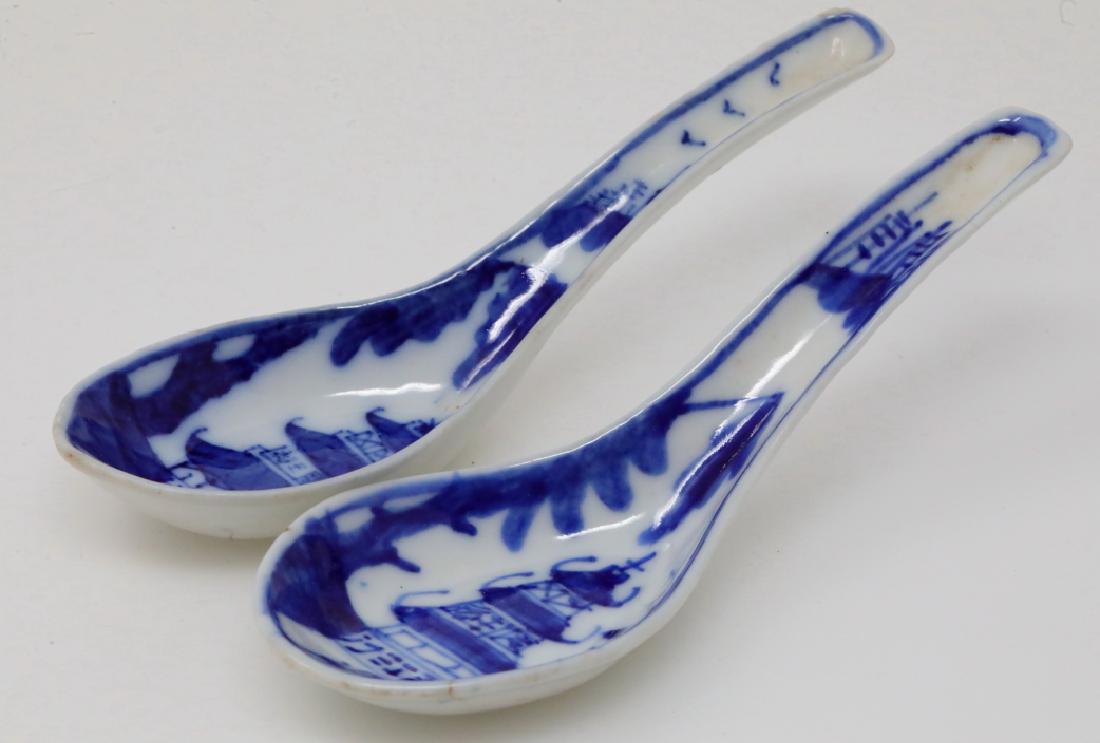 Vietnamese Pair of Bleu de Hue Soup/Rice Spoons: Vietnamese Pair of Bleu de Hue Porcelain Soup/Rice Spoons (From a Vietnamese Royal Family) - This pair of porcelain soup spoons are elaborately decorated in vivid underglazed blue with an ornate lands
