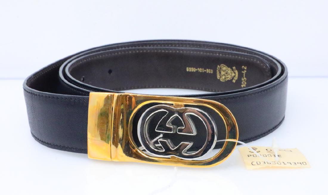 Gucci 1980s GG Logo Reversible Leather Belt: Gucci Vintage 1980s GG Logo Reversible Black/Chocolate Brown Leather Belt New W/Tags - This vintage belt by Gucci is an icon of 1980s design. This belt has never been worn, and will come with the tags