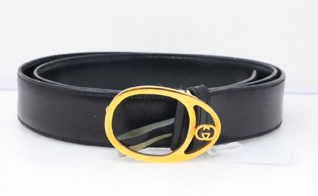 Gucci Vintage 1980s GG Logo Black Leather Belt: Gucci Vintage 1980s GG Logo Black Leather Belt (Never Worn) - This vintage belt by Gucci is an icon of 1980s design. The belt is an ultra soft black leather and is finished with a 2.25" x 1.5" gold to