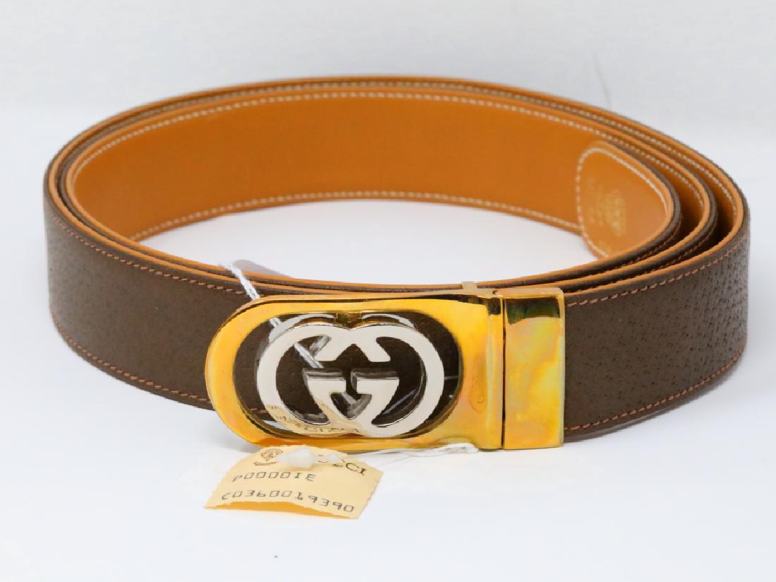 Gucci 1980s GG Logo Reversible Olive/Tan Leather Belt: Gucci Vintage 1980s GG Logo Reversible Olive/Tan Leather Belt New W/Tag - This vintage belt by Gucci is an icon of 1980s design. This belt has never been worn, and will come with the tag attached. The