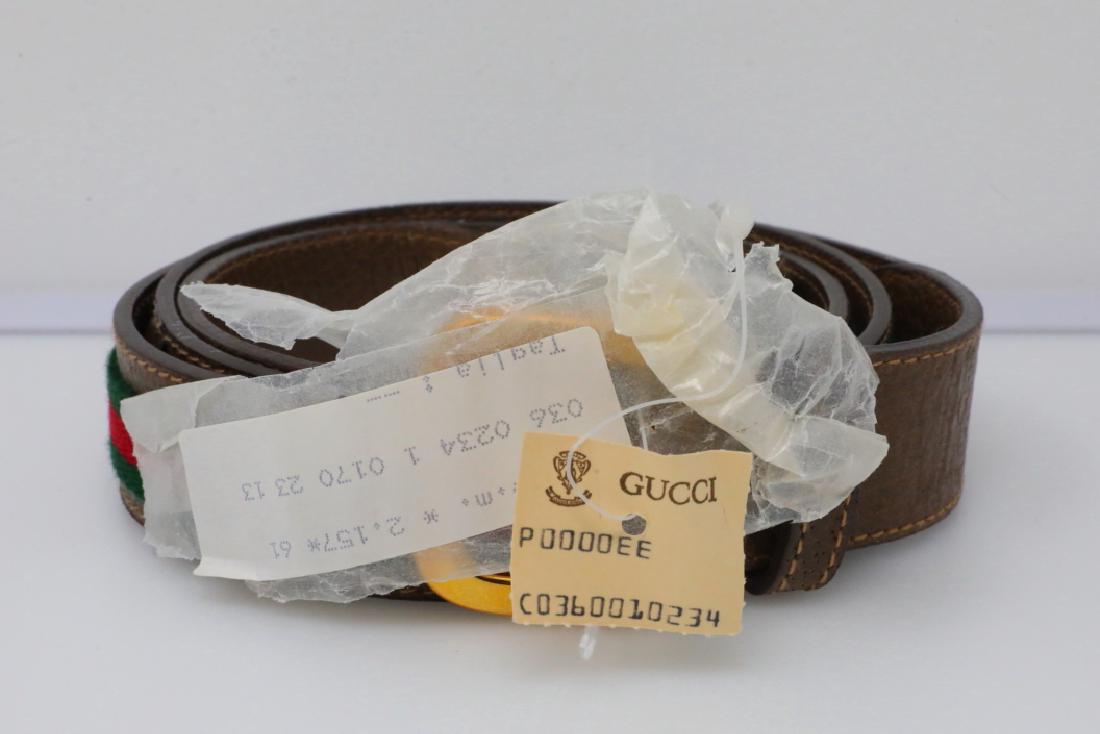 Gucci 1980s Olive Web Leather Belt New W/Tag: Gucci Vintage 1980s Olive Web Leather Belt New W/Tag - This vintage belt by Gucci is constructed of soft olive leather and is decorated with the signature red and green web stripe down the center. The