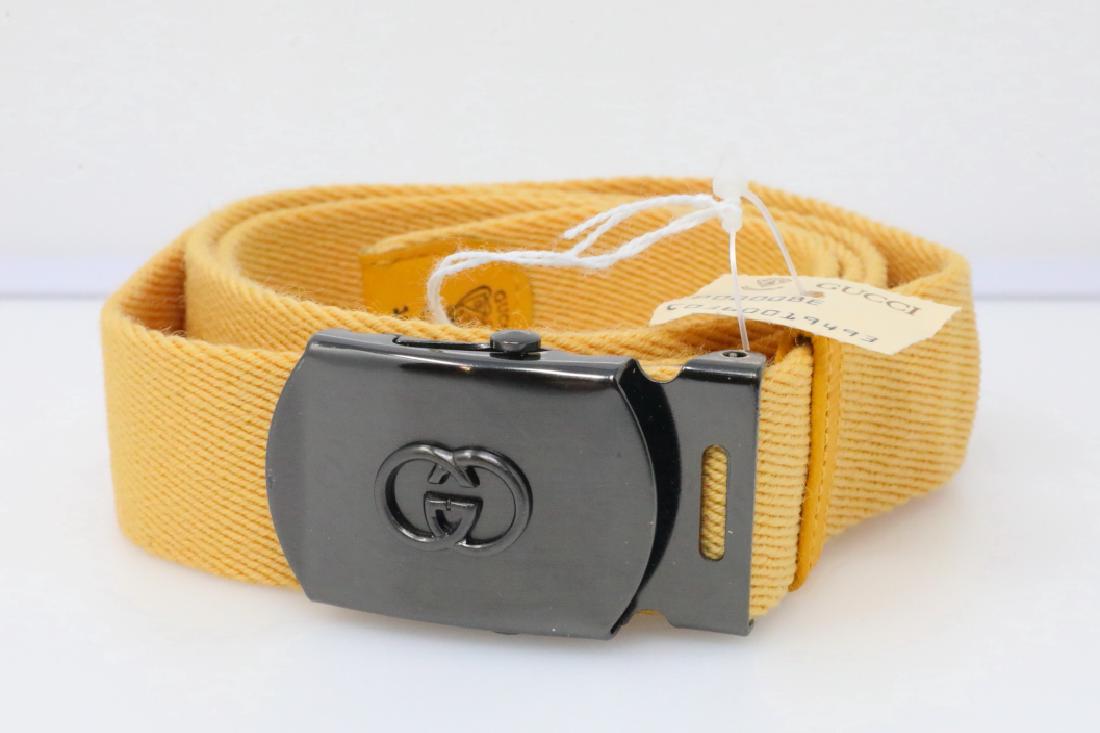 Gucci 1980s Yellow Canvas Belt New W/Tag: Gucci Vintage 1980s Yellow Canvas Belt W/GG Logo Slide Buckle New W/Tag - This vintage belt by Gucci is constructed of yellow canvas and is finished with a 2.25" x 1.25" rhodium plated slide plate buc