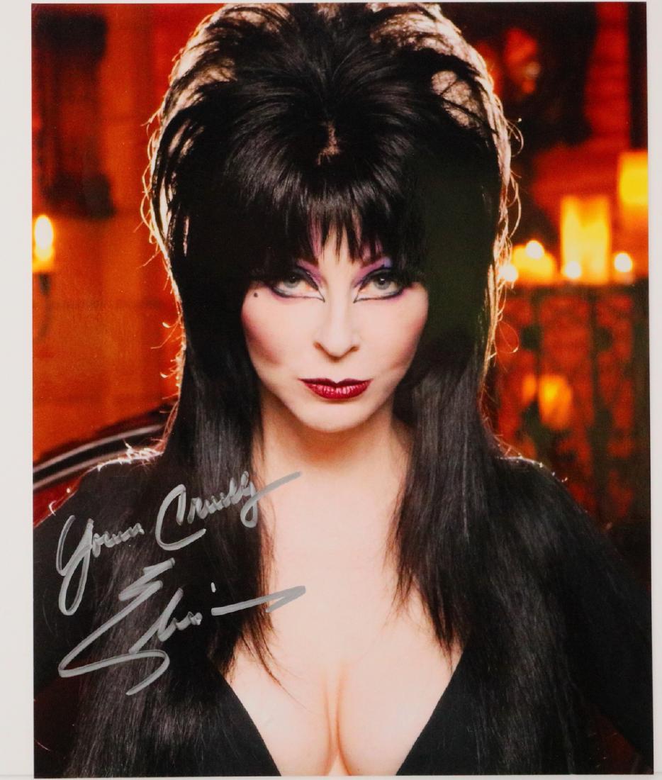 Elvira (Cassandra Peterson) Signed 8" x 10" Photo: Elvira (Cassandra Peterson) Signed 8" x 10" Photo W/Letter of Provenance - This 8" x 10" photograph pictures American actress Cassandra Peterson in her role as the horror hostess character Elvira, Mis