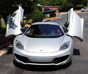 2012 McLaren MP4-12C Coupe W/Upgrades 12% BP: 2012 McLaren MP4-12C 2-Door Coupe W/Model Year 2013 Upgrades (Only 33,000 Miles) - This extremely rare car is in great running condition with under 33K miles. It has a silver tone exterior with a red