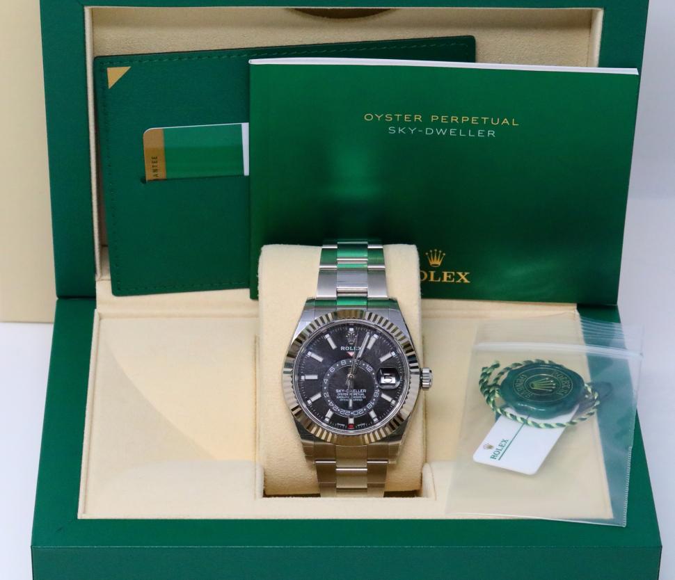 Rolex Sky-Dweller 42mm 18K/SS Watch New in Box: Rolex Oyster Perpetual Sky-Dweller 42mm 18K White Gold & Stainless Steel Watch W/Rare Black Dial New in Box with Papers (SOLD OUT) - This magnificent timepiece was crafted by the artisans at the world