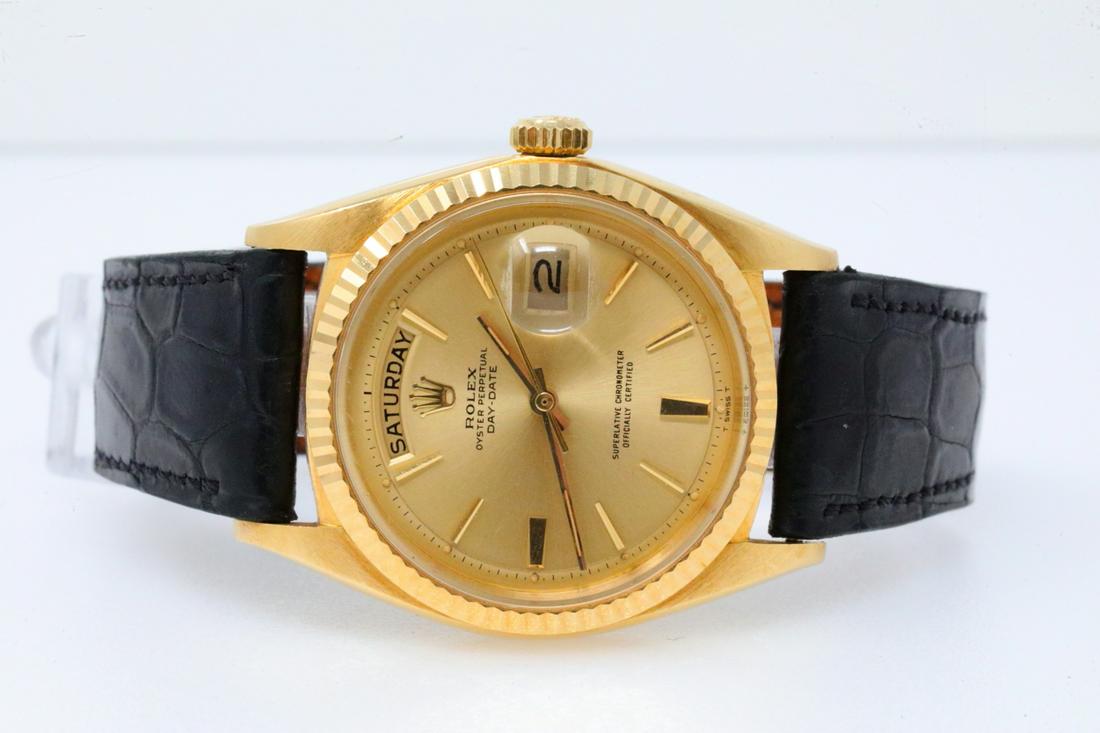Rolex 1966 Day-Date 18K 36mm Watch (Ref. 1803): Rolex 1966 Day-Date Solid 18K Yellow Gold 36mm Watch (Ref. 1803) W/Black Leather Rolex Band - This handsome timepiece was made by one of the world's most celebrated watch makers, Rolex. There are few 