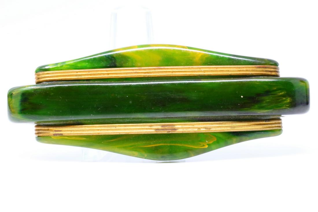 1950s Vintage Marbled Green Bakelite 3.25" Brooch: 1950s Vintage Marbled Green Bakelite 3.25" Brooch - This lovely vintage brooch is comprised of a green bakelite which has a beautiful yellow marbling. The brooch also has gold-colored ridged details a