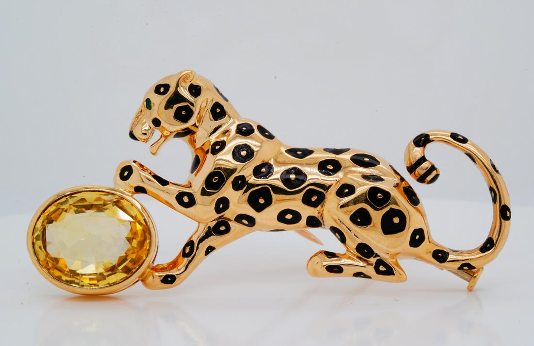 Cartier Panthere 10ct Yellow Sapphire 18K Brooch: Cartier Panthere Collection 10.00ct Yellow Sapphire & Solid 18K Yellow Gold Brooch W/Emerald & Black Enamel Accents - This striking piece by Cartier made its debut as part of the designer's iconic and