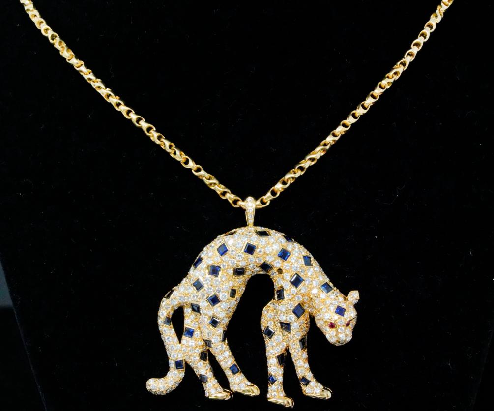 Adler 7ctw Blue Sapphire, 4.95ctw Diamond 18K Pendant: Adler 7.00ctw Blue Sapphire, 4.95ctw VS1-VS2/F-G Diamond Solid 18K Yellow Gold Pendant/Brooch on 20" Rolo Chain - This gorgeous necklace is made of solid 18k yellow gold and is comprised of a 2" x 2.2