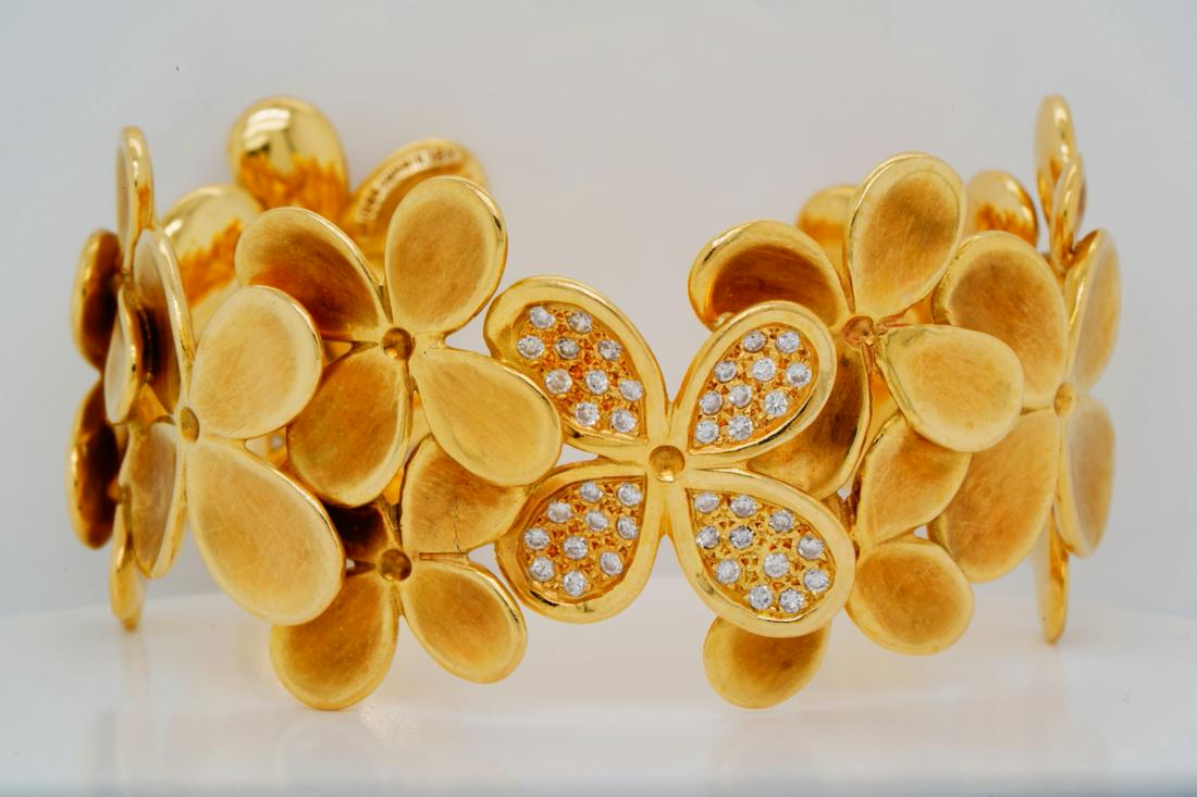 Angela Cummings 1988 1.25ctw Diamond 18K Cuff: Angela Cummings 1988 1.25ctw VS1-VS2/G-H Diamond Solid 18K Matte Yellow Gold Hydrangea Cuff Bracelet - This exquisite bracelet was made by renowned jewelry designer Angela Cummings. Prior to becoming 