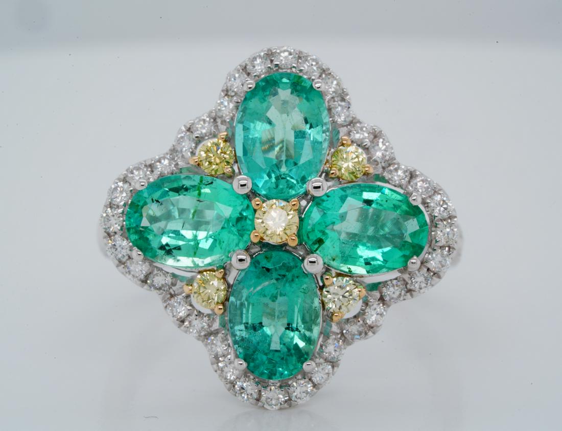 2.80ctw Emerald, 0.50ctw SI1-SI2/G-H Diamond 14K Ring: 2.80ctw Emerald, 0.50ctw SI1-SI2/G-H Diamond Solid 14K White Gold Ring W/Yellow Diamond Accents - This beautiful ring was crafted of solid 14k white gold and is decorated with approximately 2.80ctw ov