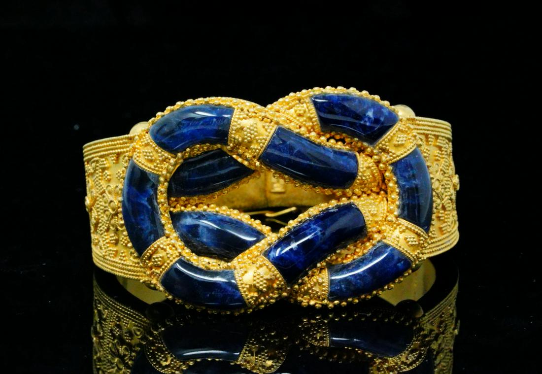 Ilias Lalaounis 18K & Sodalite Hercules Knot Bangle: Ilias Lalaounis Solid 18K Yellow Gold & Sodalite Hercules Knot Bangle Bracelet - This beautiful bangle was made by famed Greek designer Ilias Lalaounis, and was finely crafted of solid 18k yellow gold