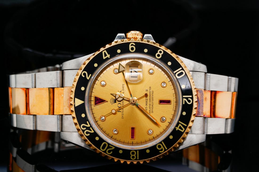 Rolex 1991 GMT Master II 18K/Stainless Steel Watch: Rolex 1991 GMT Master II 18K Yellow Gold & Stainless Steel 40mm Automatic Watch (Ref. 16713) W/Rare Serti Dial - This handsome timepiece from Rolex is a rare find, and a must have for the serious Role