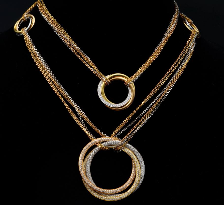 Cartier Trinity 6.90ctw Diamond 18K 32" Necklace: Cartier Trinity Collection 6.90ctw VVS2-VS1/E-F Diamond Solid 18K Tri-Color Gold 32" 6-Station Necklace - This exquisite piece from Cartier made its debut as part of the designer's iconic and instantl