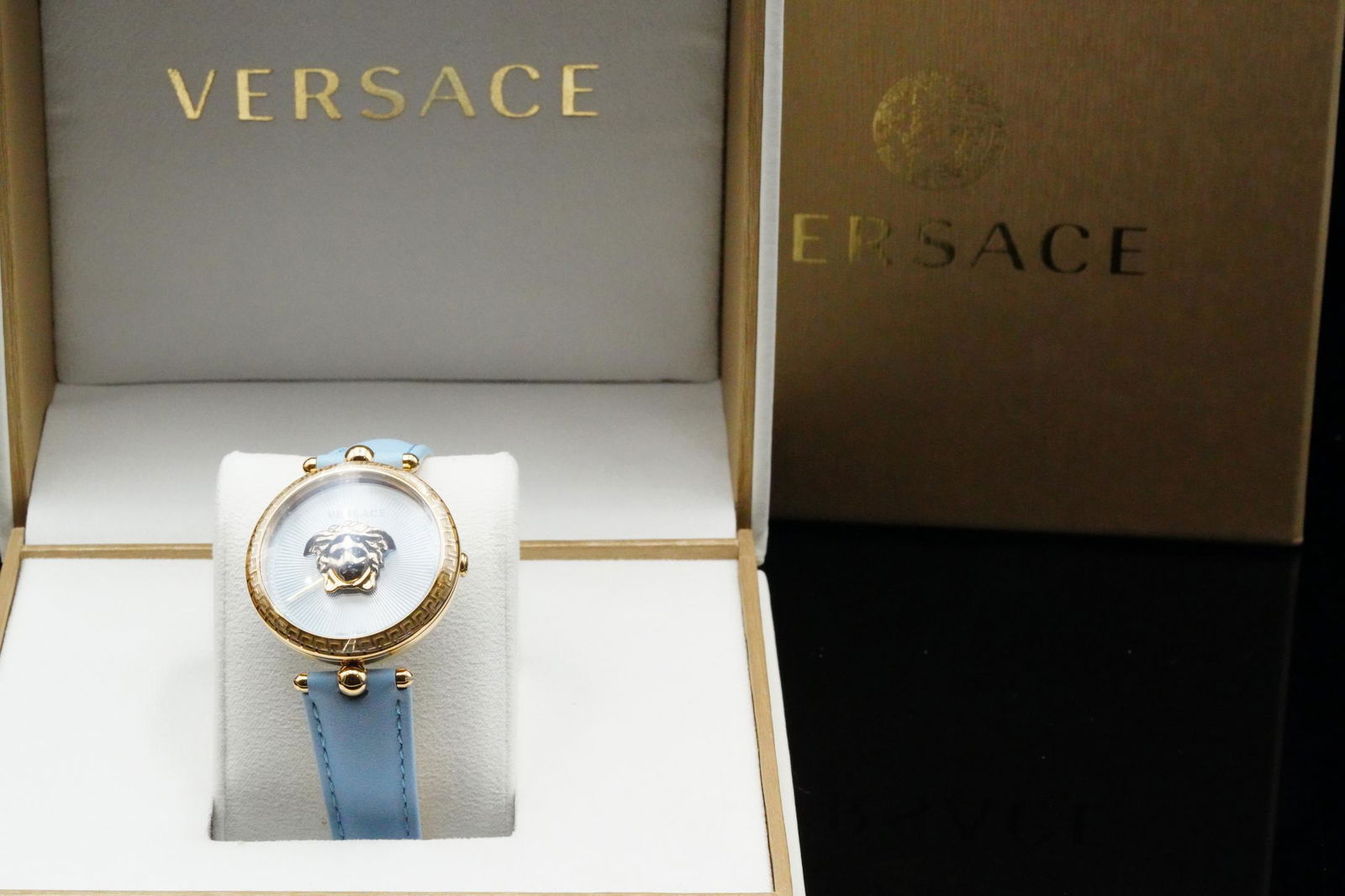 Versace Palazzo Empire 34mm Watch Unworn W/Box: Versace Palazzo Empire 34mm Gold Tone Stainless Steel & Blue Leather Watch Unworn W/Tag, Box & Booklet - This beautiful Palazzo Empire watch from Versace features a 34mm gold tone stainless steel case