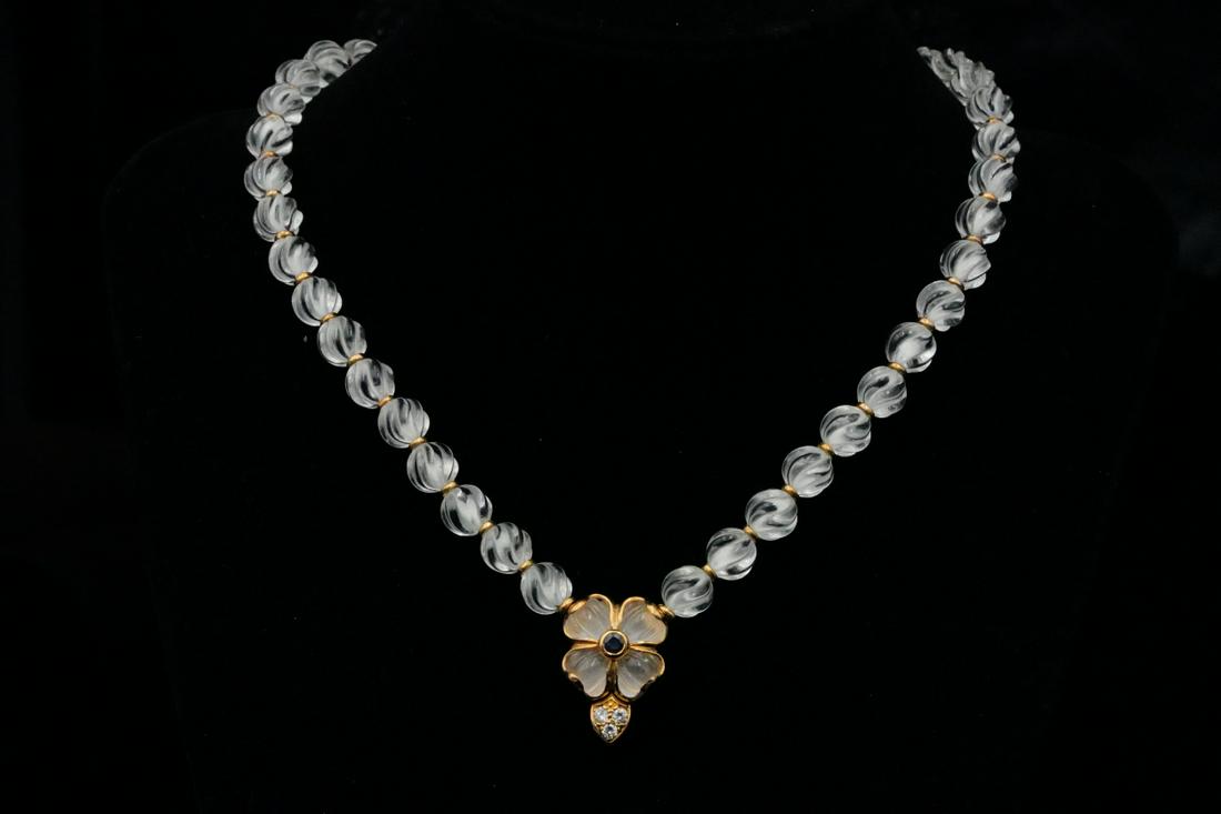Boucheron Rock Crystal & 18K Necklace W/Diamonds: Boucheron 7.5mm Carved Rock Crystal Bead and 18K Yellow Gold Necklace W/Diamond and Blue Sapphire Accents - This beautiful necklace from Boucheron is comprised of 7.5mm carved rock crystal beads with