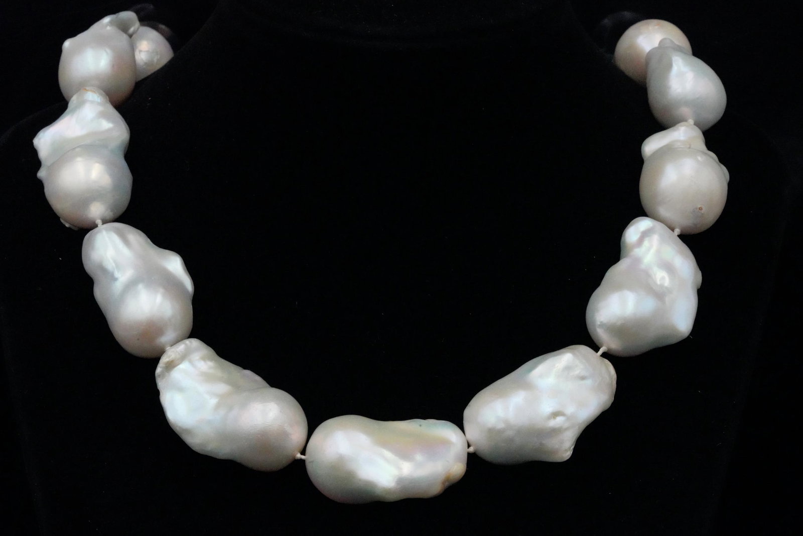 21.5mm-34.5mm Baroque Pearl 24" Necklace: 21.5mm-34.5mm Baroque Pearl 24" Necklace - This necklace is comprised of 21.5mm-34.5mm baroque pearls which have a beautiful iridescent luster. The necklace measures 24" in length. Condition: The neck