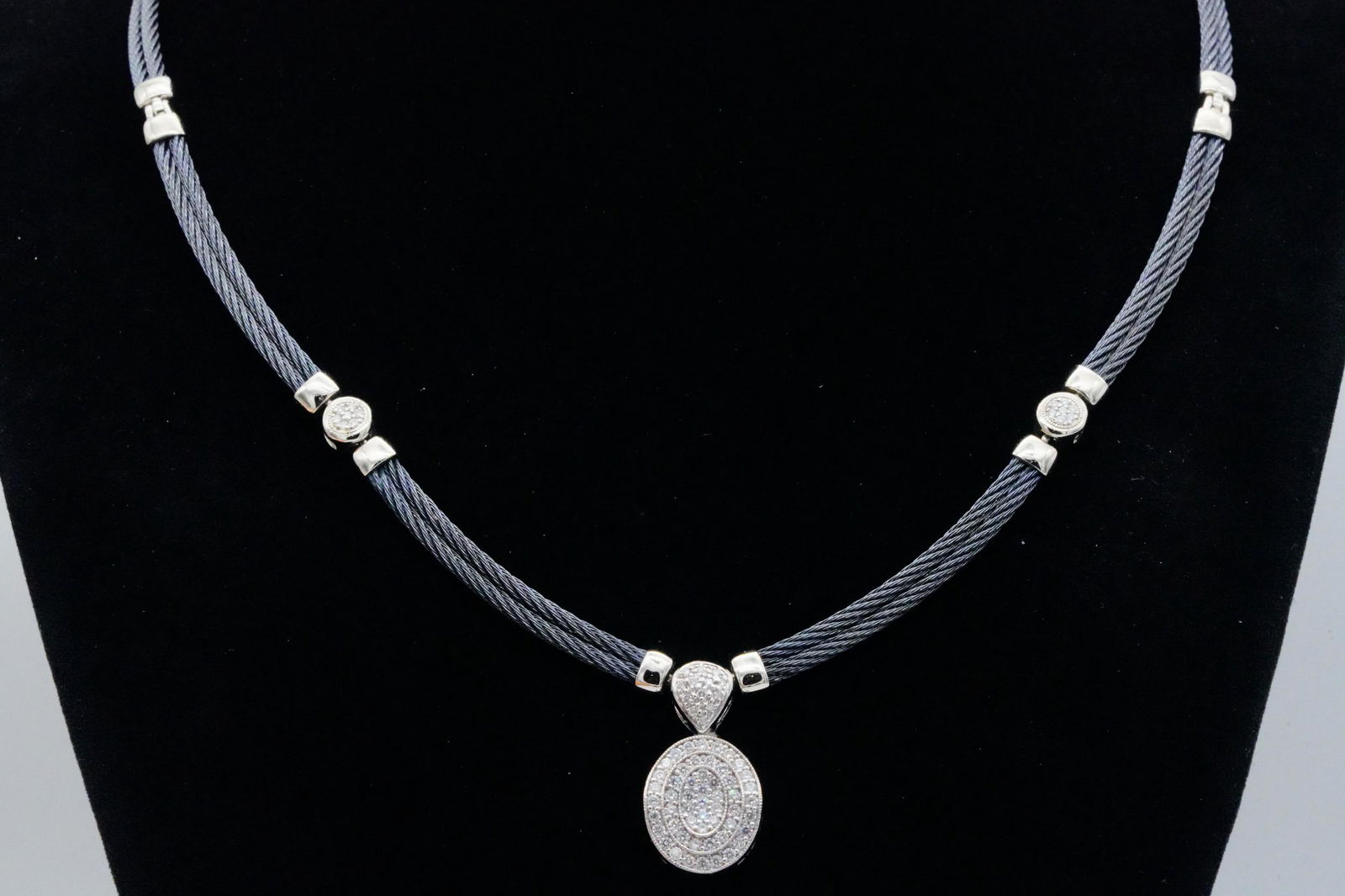 Charriol 0.60ctw Diamond, 18K & Steel Cable Necklace: Charriol 0.60ctw Pave Diamond, 18K White Gold and Black Steel Cable Necklace - This lovely necklace was made by Charriol and is crafted of two black steel cables with 18k white gold pendant and insert