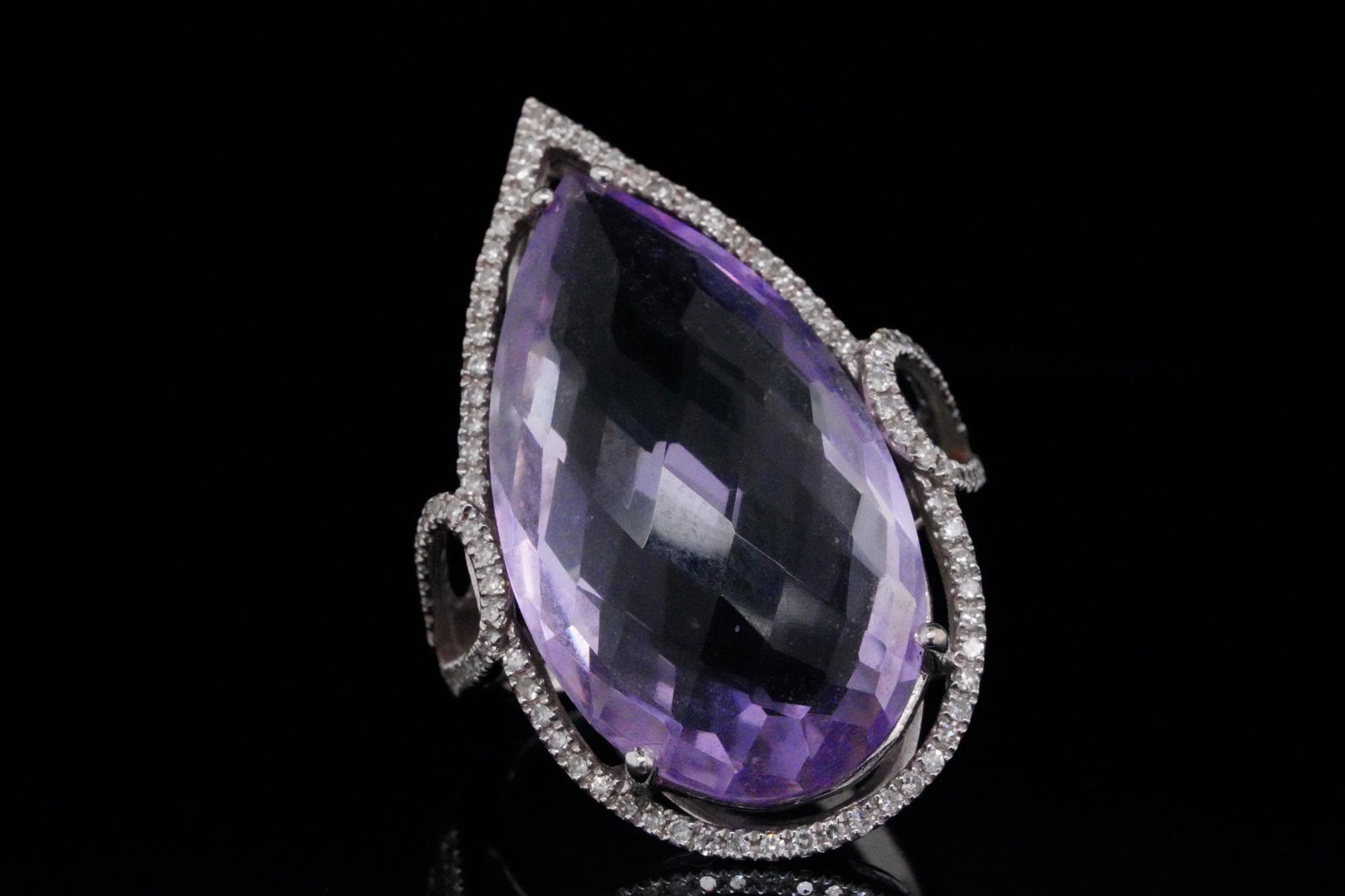 17.00ct Amethyst, 0.50ctw Diamond and 14K Ring: 17.00ct Amethyst, 0.50ctw Diamond and Solid 14K White Gold Ring - This ring is crafted of solid 14k white gold and boasts a massive 17.00ct (approximate) pear cut amethyst. The amethyst displays a lov