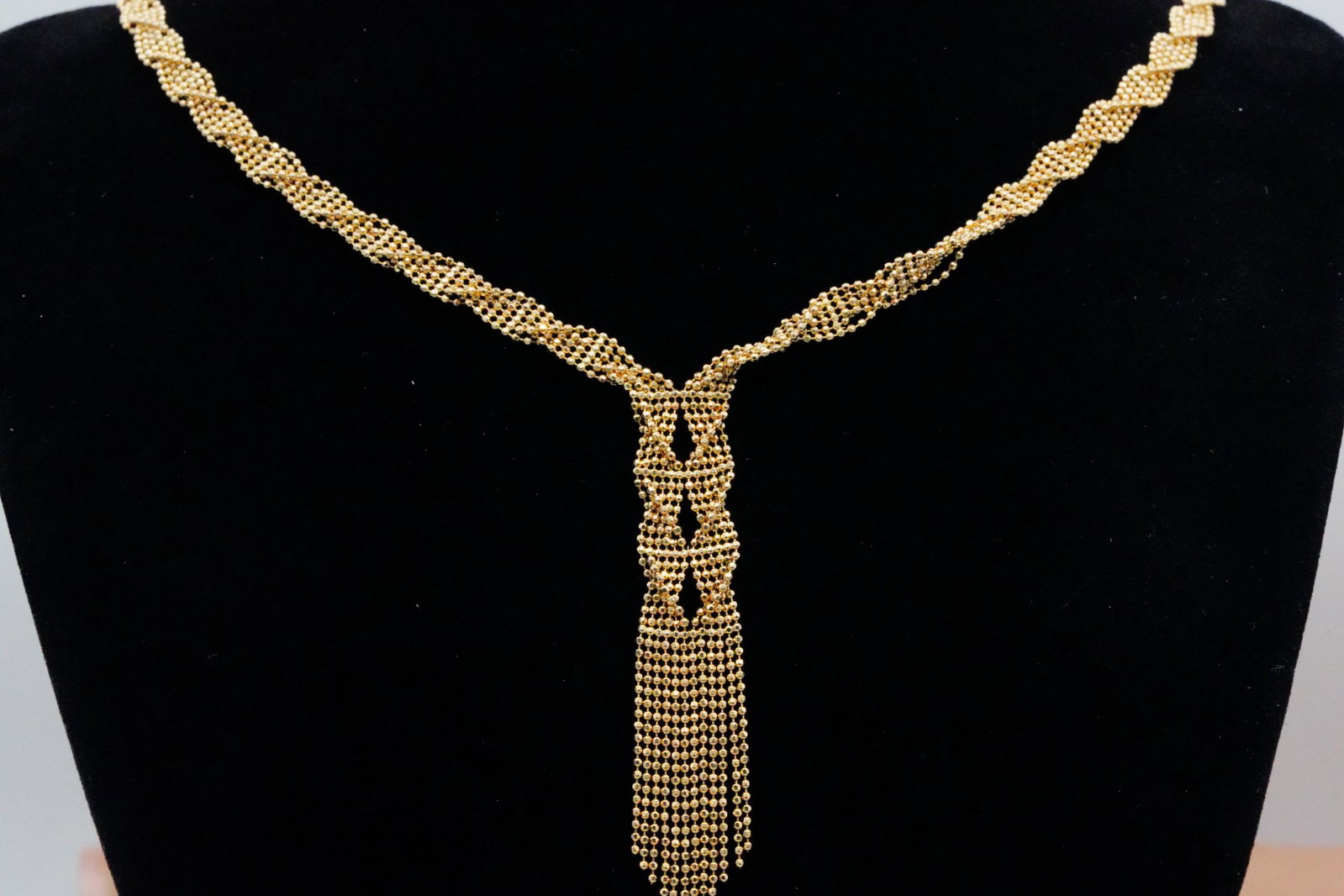Solid 14K Yellow Gold 17" Granulated Tassel Necklace: Solid 14K Yellow Gold 17" Granulated Tassel Necklace - This lovely necklace is crafted of solid 14k yellow gold and has an elegant design with glittering interwoven granulated chains. The necklace mea