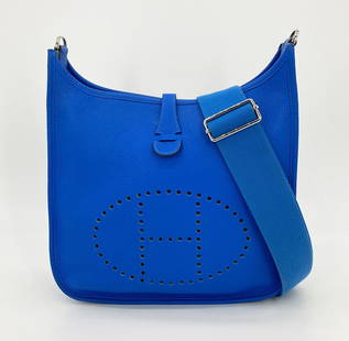 Hermes Blue Electric Clemence Leather Evelyne III PM: Hermes Blue Electric Clemence Leather Evelyne III PM Shoulder Bag - This chic messenger bag from Hermes is the Evelyne III PM shoulder bag in gorgeous Blue Electric Clemence leather. The handbag has a