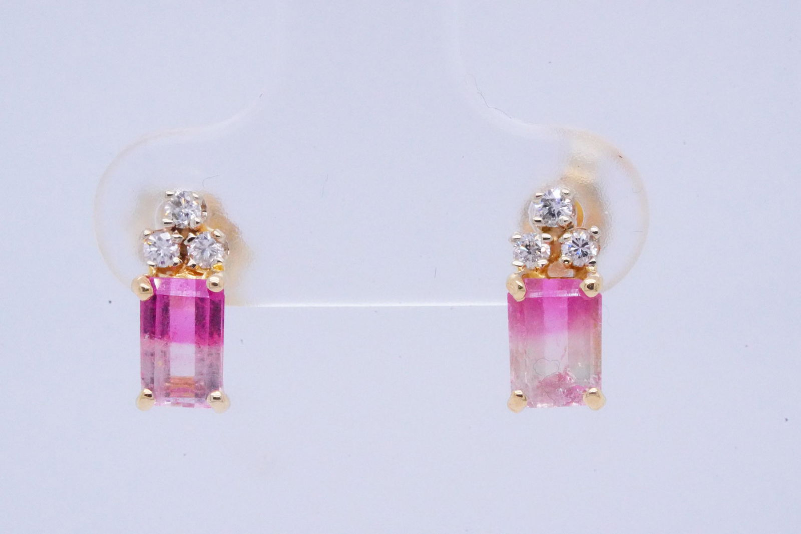 1.00ctw Bi-Color Tourmaline and 14K Earrings W/Diamonds: 1.00ctw Bi-Color Tourmaline and 14K Yellow Gold Earrings W/Diamond Accents - These lovely stud earrings are crafted of 14k yellow gold and each boast an approximately 0.50ct bi-color tourmaline that d