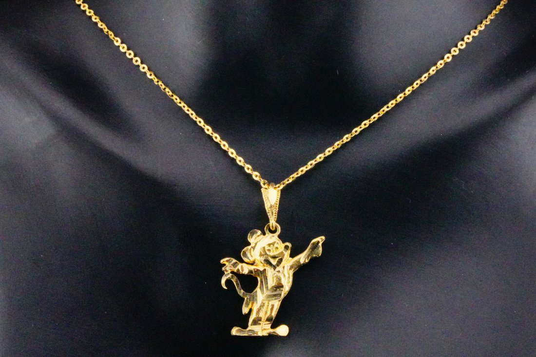 Solid 14K Yellow Gold Mickey Mouse Pendant Necklace: Solid 14K Yellow Gold Mickey Mouse Pendant Necklace - This necklace is crafted of 14k yellow gold and comprised of a 1" Mickey Mouse pendant hanging from a 16" chain. Condition: Excellent condition wi