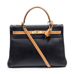 Hermes Black and Gold Kelly Retourne Bi-Color 35: Hermes Black and Gold Clemence Leather Kelly Retourne Bi-Color 35 W/Dustbag - This exquisite handbag is the iconic Kelly bag by Hermes. Like the Hermes Birkin, the Kelly ranks as one of the most