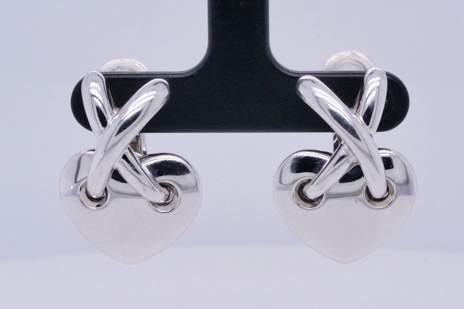 Chaumet Solid 18K White Gold 1" Heart Ear Clips: Chaumet Solid 18K White Gold 1" Heart Ear Clips - These lovely ear clips were made by Chaumet and were finely crafted of solid 18k white gold. The earrings have an elegant design with an X at the top
