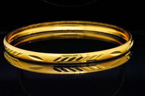 24K Yellow Gold Bangle Bracelet From Dubai Gold Market: 24K Yellow Gold Bangle Bracelet From Dubai Gold Market - This bangle is meticulously fashioned from 24-karat yellow gold, signifying its exceptional quality and rarity. This bracelet encapsulates the