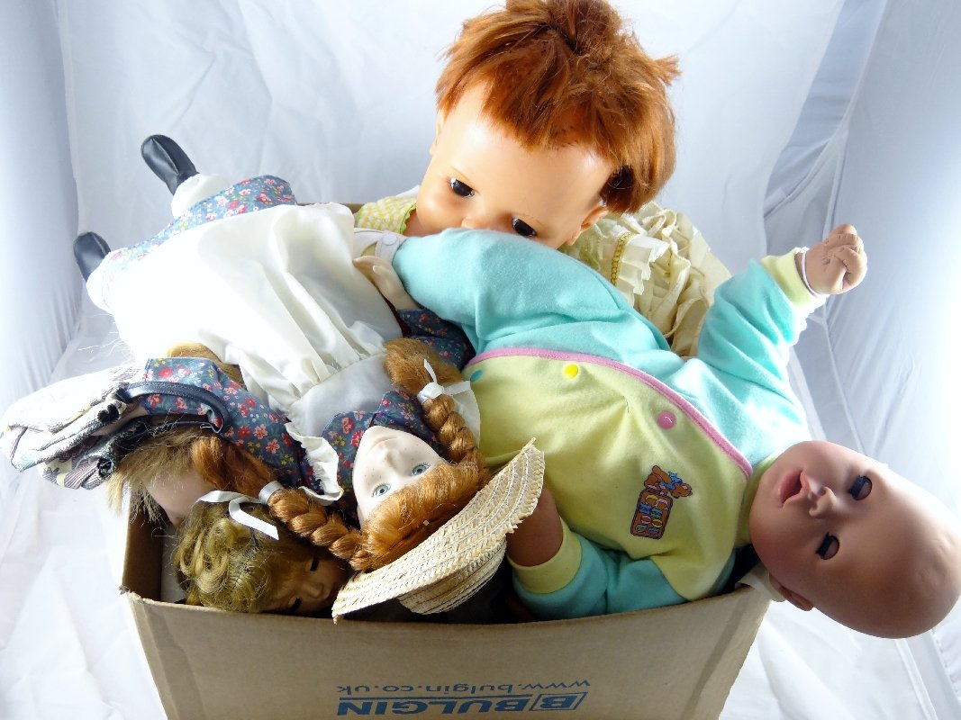 Lot of (7) Collectible Baby Dolls W/Extra Dresses: "Anne of Green Gables" doll, "Chrissy" growing hair doll, & more. All of the dolls are in good condition.