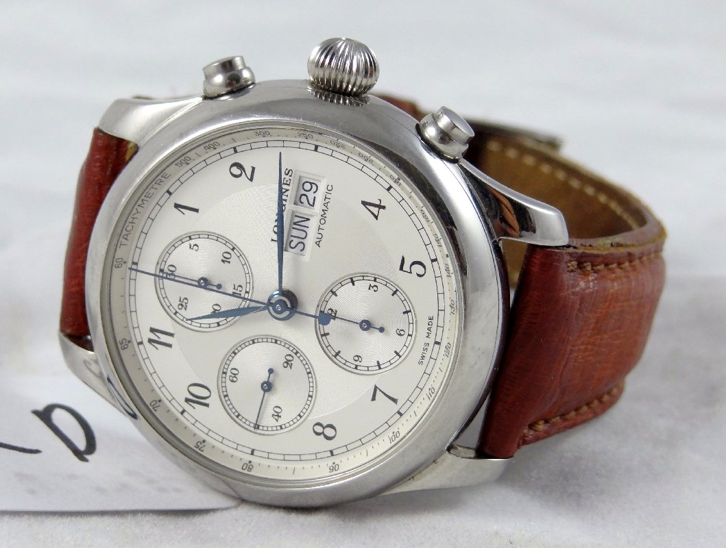 Men's Longines Chronograph Watch W/COA: This *Authentic* Longines 2317 features: Mechanical 17 Jewel/750 Valjour movement A handsome chronograph display A Stainless steel 40mm display Double calender Day/Date Display Brown leather strap & O