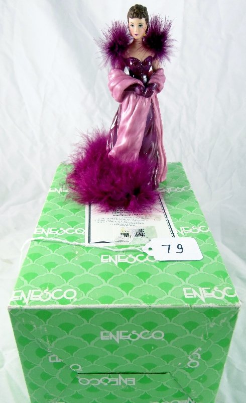 Gone With The Wind Scarlette O'Hara Porcelain: This is a beautiful Porcelain Bell figurine of Scarlett O'Hara in the infamous red dress. Her face is lovely and finely painted. The feathers on her shoulders and bottom of her dress are a nice touch.