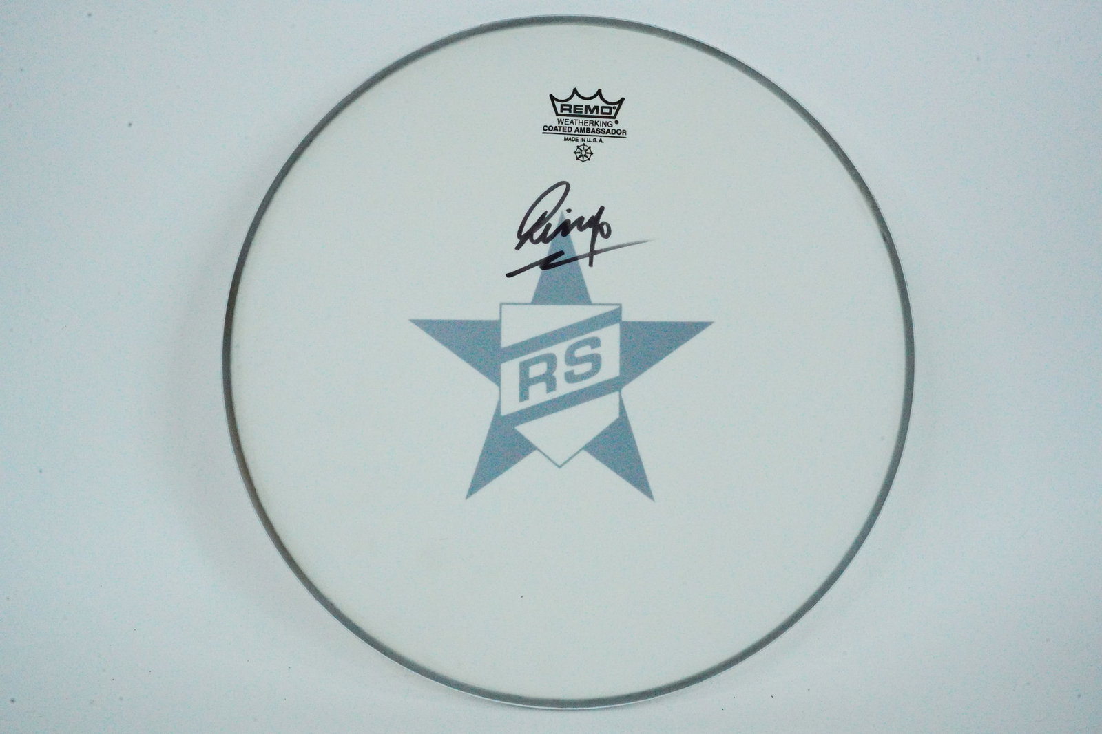 Ringo Starr Autographed Remo Drumhead: Ringo Starr Autographed Remo Drumhead - This Remo drumhead is signed by legendary Beatles drummer Ringo Starr. Ringo Starr not only gained worldwide fame as a member of the Beatles, but also had a suc