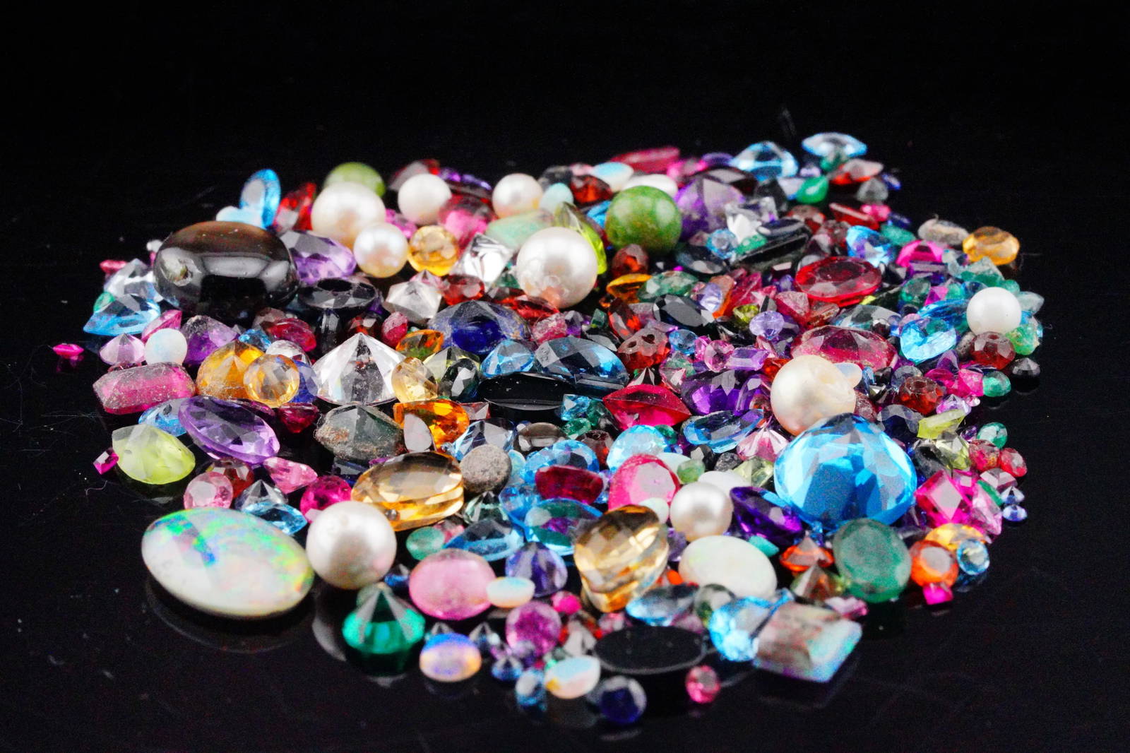 Bag Of Misc. Unsearched Loose Gemstones Auction